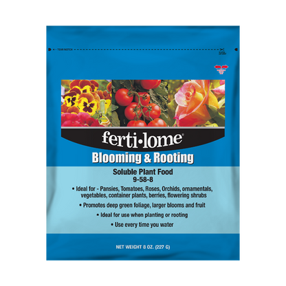 Fertilome Blooming & Rooting plant food package with images of flowers and vegetables on a blue background.